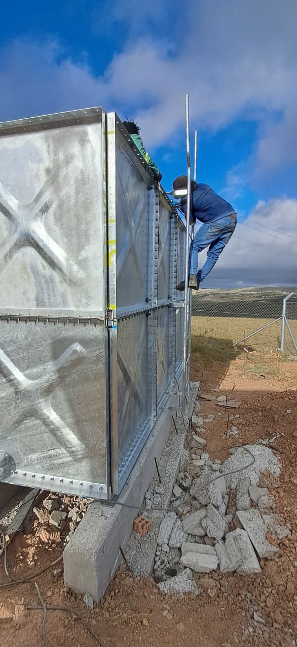 Side view of the bolted HDG steel panels on the eZambuzane water tank