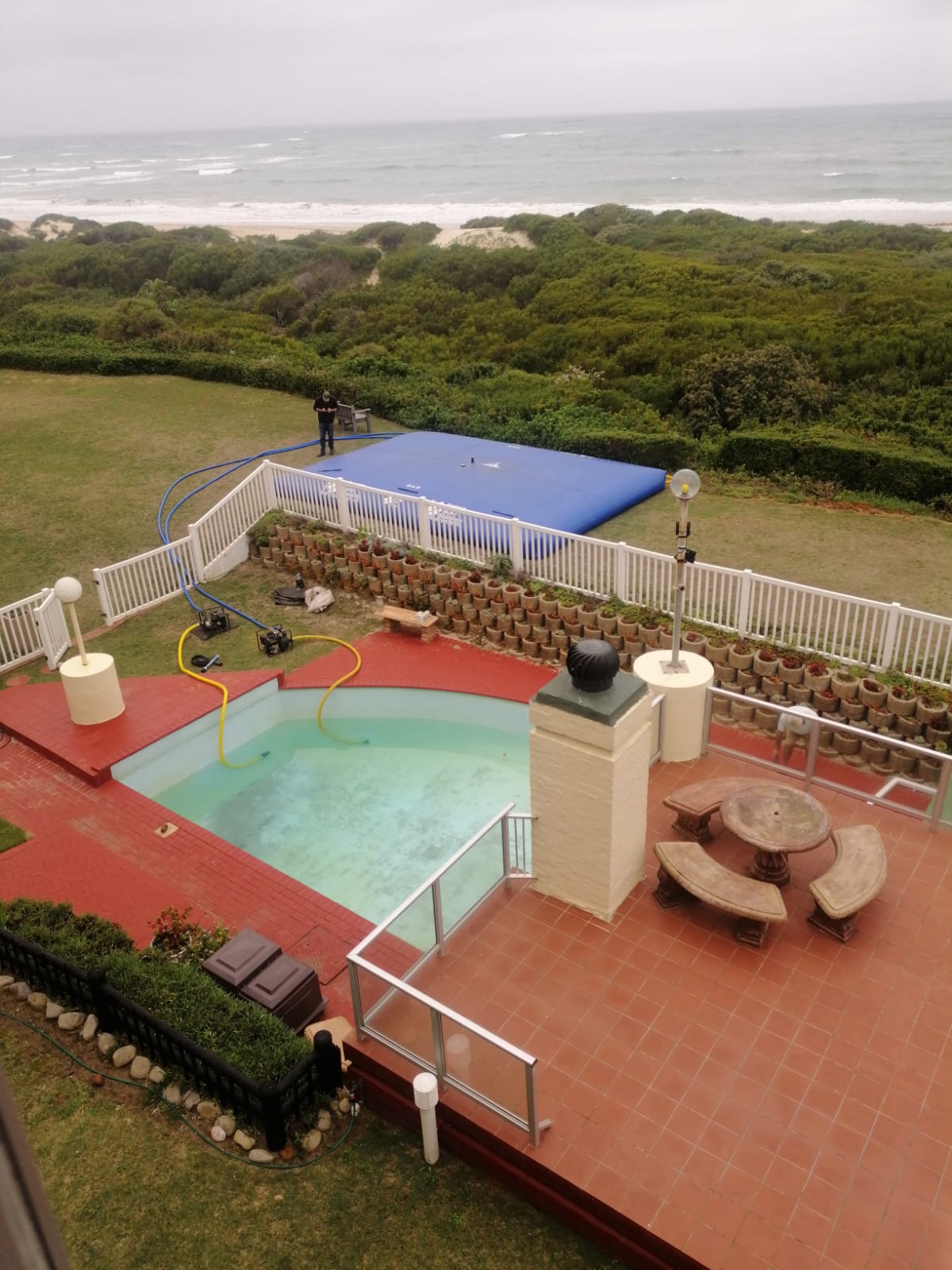 Aerial view of pool water pumped into a water storage bladder in Aston Bay