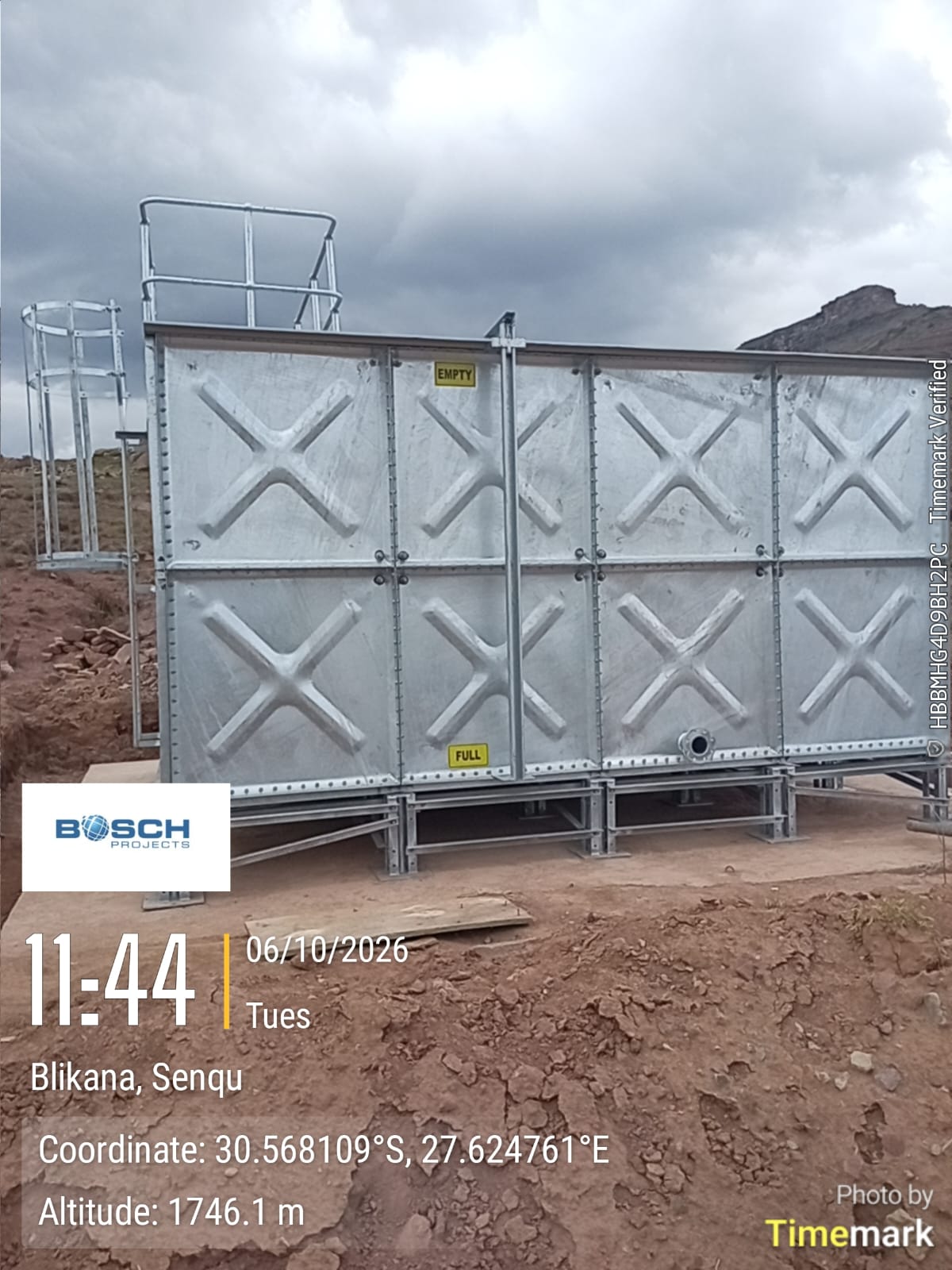 Close-up of the galvanised 50 kL square panel tank on its steel base frame in Blikana