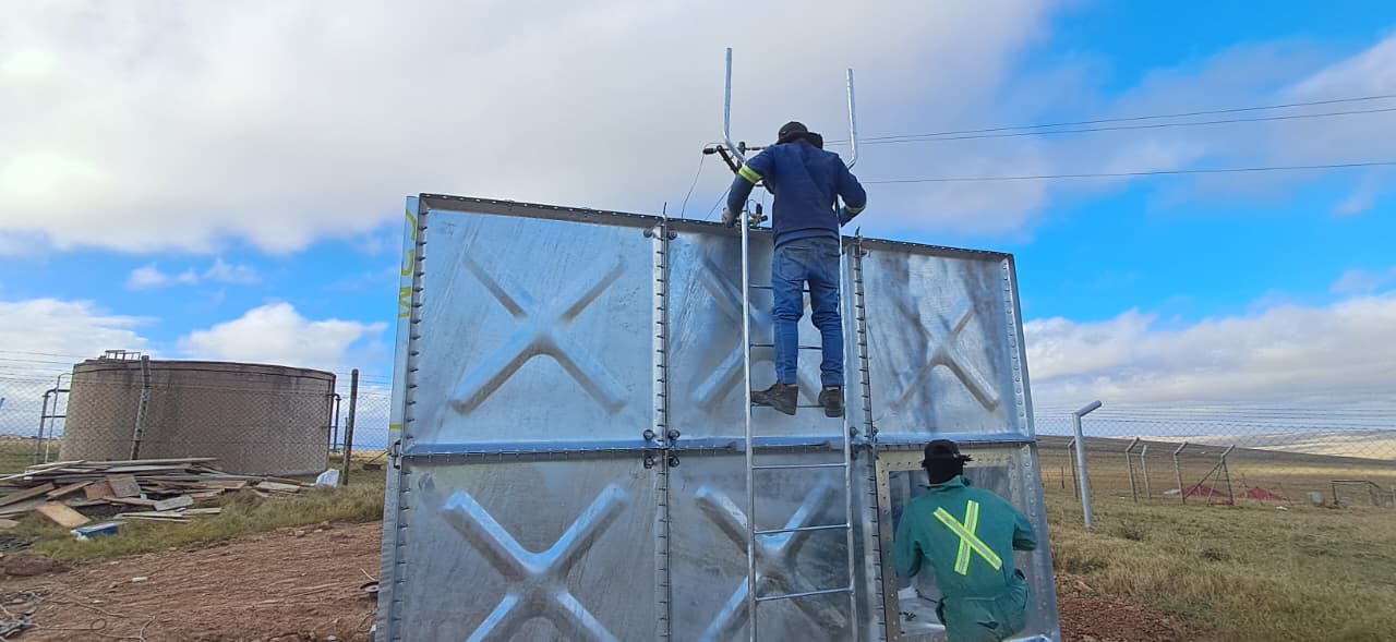 Fitting the access ladder to the 20 kL square panel tank at eZambuzane