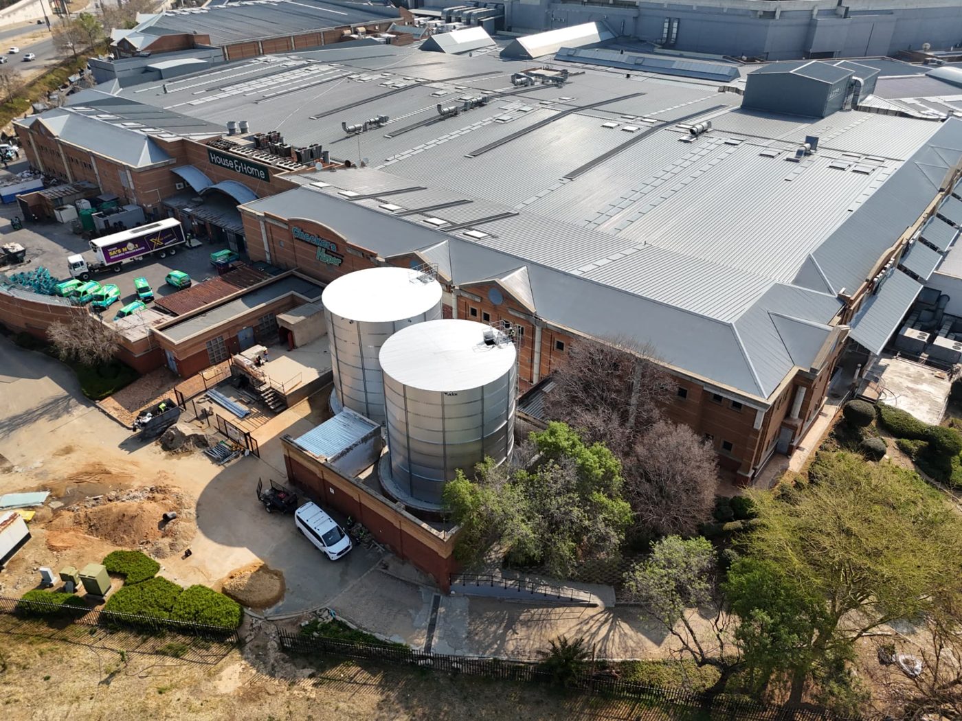 Twin cylindrical Aluzinc bulk water storage tanks installed at Fourways Mall in Sandton